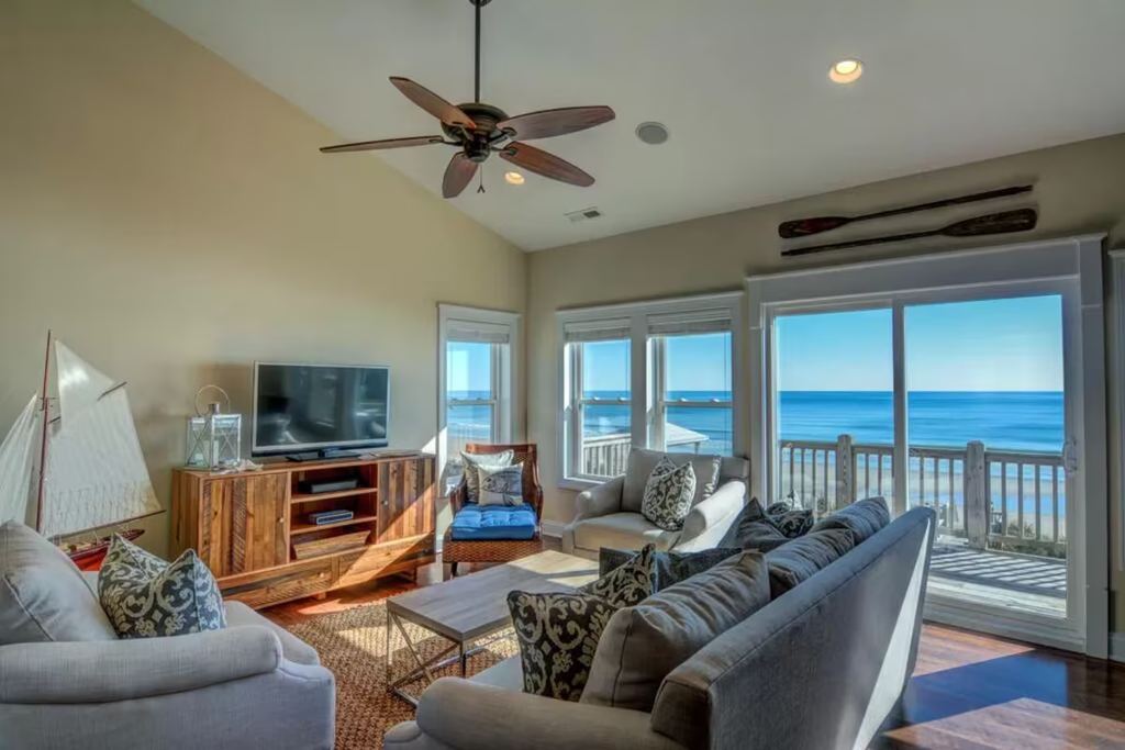 Living room at Seaside Sanctuary, oceanfront view through the sliders