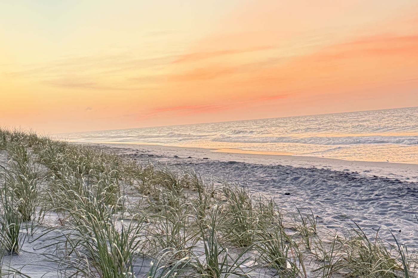 Empty beach and dunes at sunset near Seaside Sanctuary